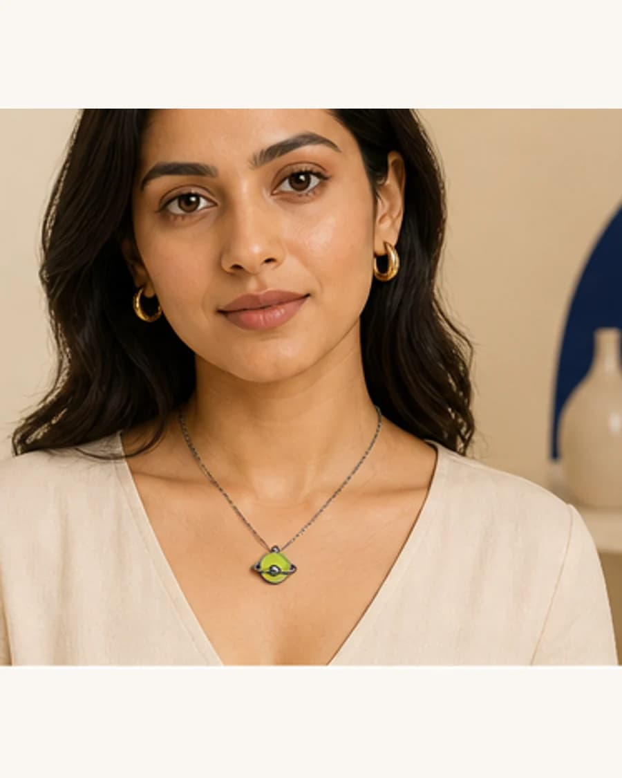 Orbit Pendant Necklace: front styling view on an adult Indian model