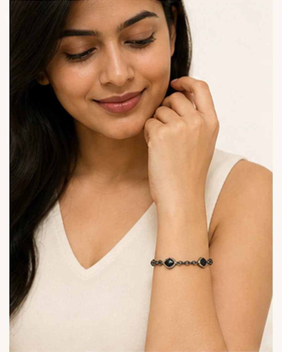 Riviera Charm Bracelet: front styling view on an adult Indian model