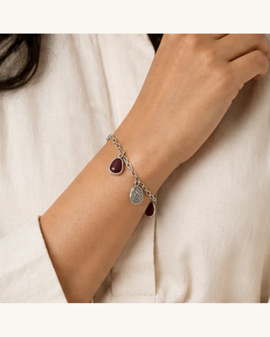 Terrain Charm Bracelet: front styling view on an adult Indian model