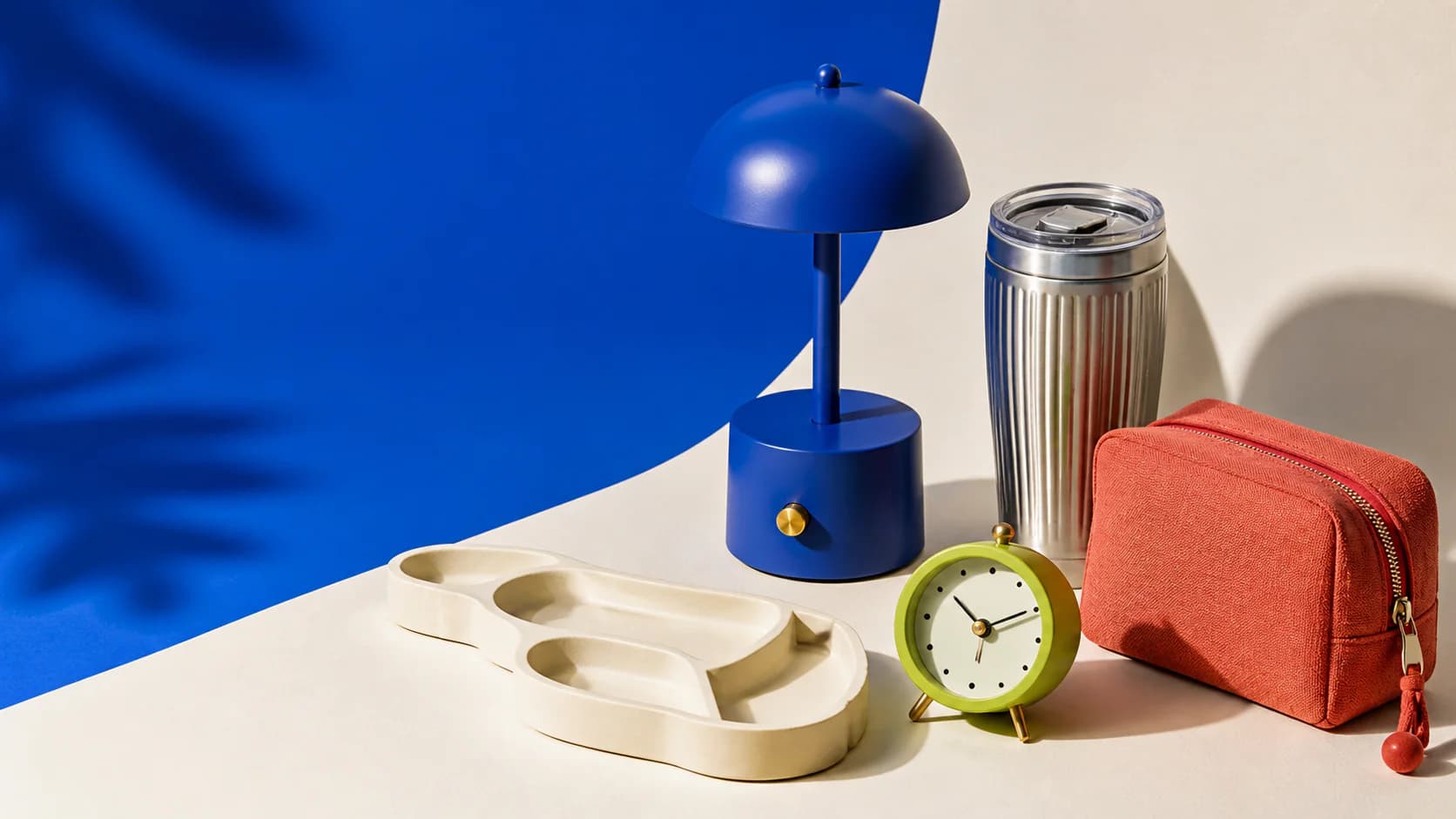 Colourful JBRB everyday objects arranged in a sunlit studio